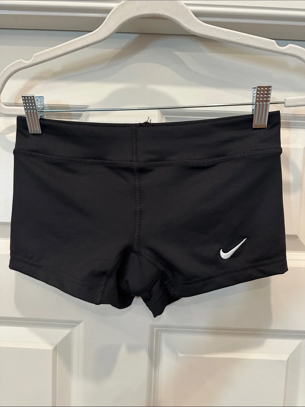 Nike Women's Black Athletic Shorts with White Swoosh Accent